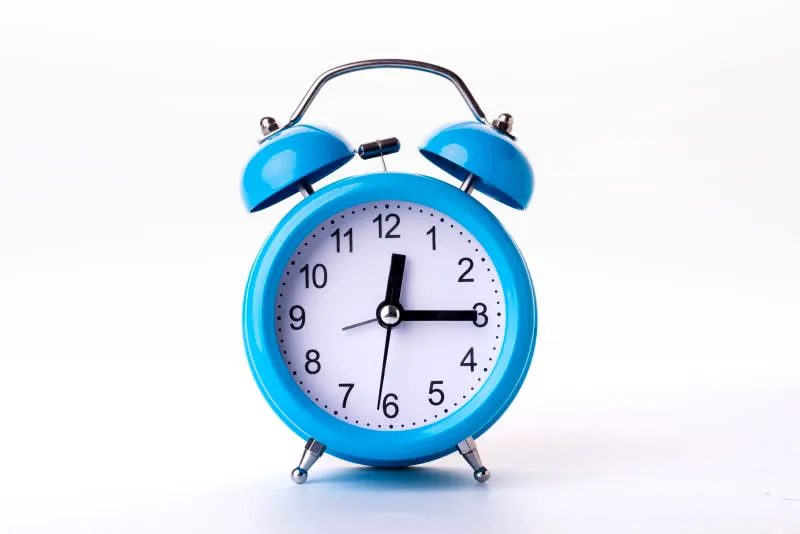 a picture of a blue alarm clock