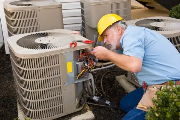 A work inspecting a hvac unit