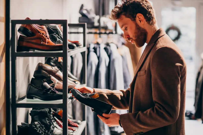 A Man shopping for shoes